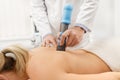 Extracorporeal Shockwave Therapy ESWT.Non-surgical treatment.Physical therapy for neck and back muscles,spine with shock Royalty Free Stock Photo