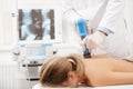 Extracorporeal Shockwave Therapy ESWT.Non-surgical treatment.Physical therapy for neck and back muscles,spine with shock Royalty Free Stock Photo