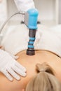 Extracorporeal Shockwave Therapy ESWT.Non-surgical treatment.Physical therapy for neck and back muscles,spine with shock Royalty Free Stock Photo