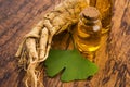 Extract oil of ginseng root and ginkgo biloba leaves Royalty Free Stock Photo