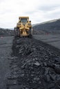 Extraction of minerals. Heavy powerful bulldozer in the quarry