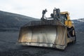 Extraction of minerals. Heavy powerful bulldozer in the quarry