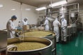 extraction and processing plant, with workers extracting essential oils from various herbs