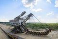 Extraction of sand in the quarry of a huge excavator