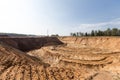 Extraction in a sand quarry with powerful machines and a washing lake Royalty Free Stock Photo