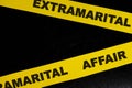 Extramarital affair crime scene, caution and warning concept. Yellow barricade tape with word in black background. Royalty Free Stock Photo