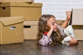 Extraordinary Location. Cardboard boxes - moving to new house. purchase of new habitation. happy child cardboard box Royalty Free Stock Photo