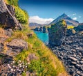 Extraordinary summer view of small fishing village at the foot of Mt. Stapafell - Arnarstapi or Stapi.