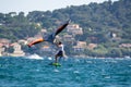 Hyeres, Almanarre beach, France, July 10, 2021. Extreem water sport - wing foil, kite surfing, wind surfindg, windy day on