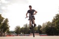 Boy jumping with his street-bike bmx in skate park Royalty Free Stock Photo