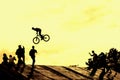 Extrem Sport and risk. Performance at competitions. Silhouette of unidentified young man performs stunts on background Royalty Free Stock Photo