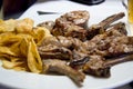 Extremadura suckling lamb chops with potato chips Royalty Free Stock Photo