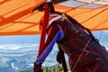 Extremal man with hang-glider preparing to fly Royalty Free Stock Photo