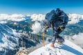 Extreme alpinist in high altitude on Aiguille de Bionnassay mountain summit, Mont Blanc massif, Alps, France, Europe