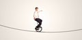 Extreme business man riding unicycle on a rope Royalty Free Stock Photo