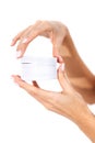 Extreme close up of beautiful graceful female hands with white manicure holding mock up of round box