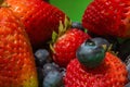 Extreme close up of blackberries and strawberries Royalty Free Stock Photo