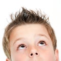 Extreme close up of boy looking up. Royalty Free Stock Photo