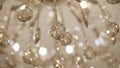 Extreme close-up of bright golden ceiling shade in expensive accommodations. Luxurious lampshade hanging in high-class