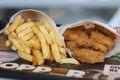 Extreme close up of Chicken Nuggets and French Fries.