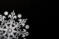 Extreme close up of cropped white rangoli design on black background. diwali concept