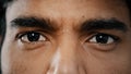 Extreme close up face of young arabian male adult model man male eyes with dark eyeballs stare looking at camera show