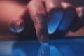 Extreme close up of female finger using digital tablet computer Royalty Free Stock Photo
