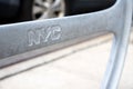 Extreme close-up of gray bike round stand with engraved NYC