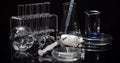 Laboratory Equipement: Syringe and Medicine, Test Tubes and Flasks Rotating on Black Background. Royalty Free Stock Photo