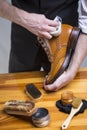 Extreme Close Up of Mans Hands Cleaning Luxury Calf Leather Brogues Royalty Free Stock Photo