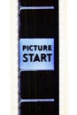 Start text message sign on movie film strip concept of opening words Royalty Free Stock Photo