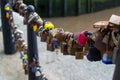 Extreme close up of multicolored padlocks or locks in the fence of a bridge in Liverpool dock, England, United Kingdom