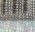 Extreme close-up of pierres du Rhin jewels with bokeh reflections on a mirror