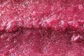 Extreme close-up of a purple grape popsicle with ice crystals and texture; background Royalty Free Stock Photo