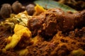 Extreme close-up of Rendang spices, including turmeric, galangal, and lemongrass, used to make the rich and aromatic curry dish