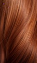 Extreme close-up shot of hair texture, with slight curves brunette with auburn highlights