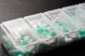 Extreme close up of seven day pill box with pills. Blu pill-box Royalty Free Stock Photo
