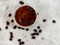 Extreme close up shot of coffee powder, beans on the top with defocused background - activeness concept