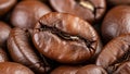 Extreme close-up of a single roasted coffee bean with deep cracks and texture Royalty Free Stock Photo