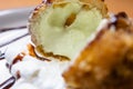 Fried ice cream with chocolate syrup and cream on plate Royalty Free Stock Photo