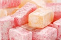 Extreme close up of traditional bulgarian rose flavoured and ordinary turkish delight cubes with powdered sugar icing Royalty Free Stock Photo