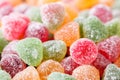 Close up of a variety of mint jelly bonbons with sugar crystals icing in different flavors and colors. Macro food background textu