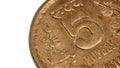 Extreme close up view of Brass five rupee Indian coin