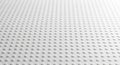 Close-up of a textured white surface with a repeating pattern of small raised dots background Royalty Free Stock Photo