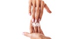 Extreme close up of young caucasian woman hands with white manicure and cream on them Royalty Free Stock Photo