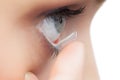 Extreme close up on young model applying contact lens Royalty Free Stock Photo