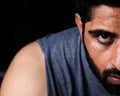 Closeup of Beard man cleaning sweat with towel after workout