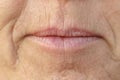 Extreme Closeup on the mouth of a middle-aged woman Royalty Free Stock Photo