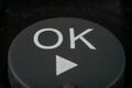 Extreme closeup of a ok button on TV remote Royalty Free Stock Photo