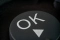 Extreme closeup of a ok button on TV remote Royalty Free Stock Photo